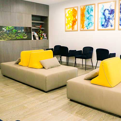 Clinic hallway featuring modern artwork at Cross Road Dental