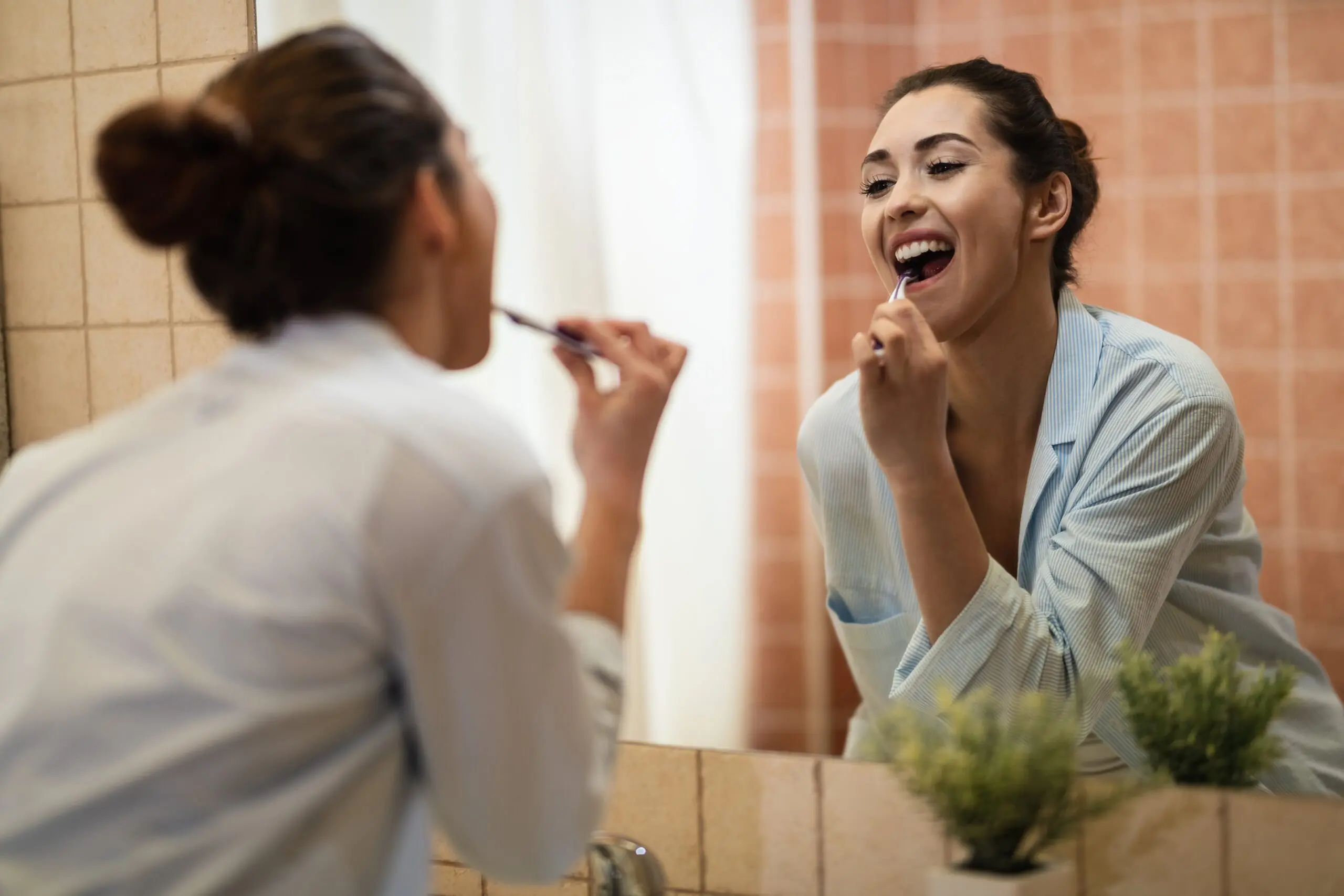 woman brushing her teeth